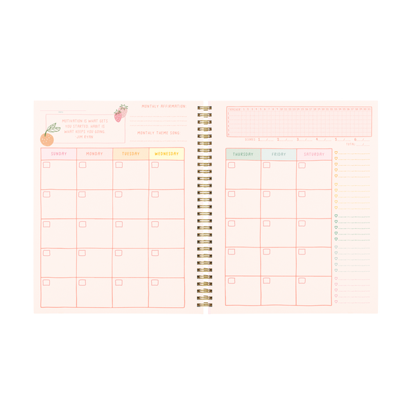 A monthly calendar spread across two pages with a habit tracker on the top right of the right page. Pages are light pink, with the days being in rainbow lettering.