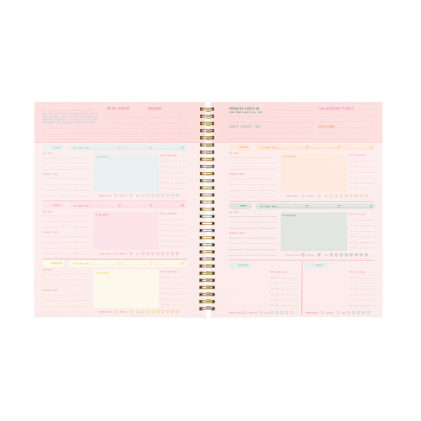 A multicolored, two page planner spread with note sections, goal sections, and habit tracker sections.