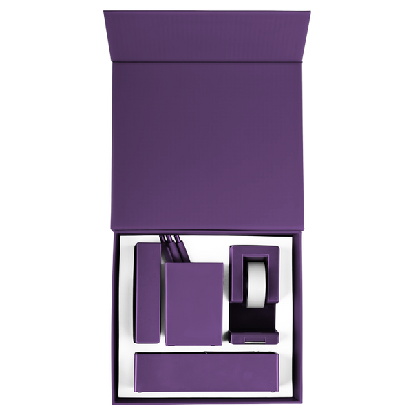 A purple desk set with a tape dispenser, two different desk organizers, and a stapler.