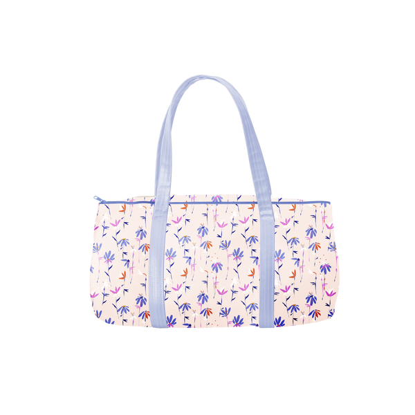 a duffel bag with periwinkle straps and magic sprigs print