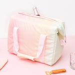 Small Pastel soft-sided cooler with a champagne bottle inside