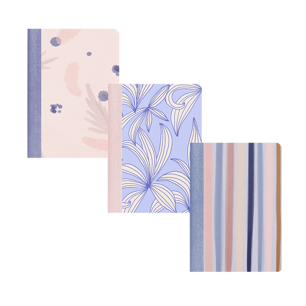 Three indigo dreams mini notebooks. One with periwinkle leaves, one with different color blue stripes, one with watercolor that is pink and blue