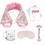 flat image of a collection of self care items including a neck wrap in a rainbow wavy line print, a clear glass mug that says not today, a weighted eye mask with a tiny hearts imprint, a greeting card that yes you can, and a rose quartz roller with roll with it imprinted in dark pink. 
