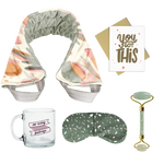 flat image of a collection of self care items including a neck wrap with a muted abstract floral print, a clear glass mug that says so many feelings, a weighted eye mask with green terrazzo imprint, a greeting card that says you got this, and a jade roller with roll with it imprinted in dark green. 