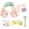 flat image of a collection of self care items including a neck wrap in a soft rainbow gradient print, a clear glass mug that says daydreamers club, a weighted eye mask with lemons imprint, a greeting card that says so many feelings, and a jade roller with roll with it imprinted in dark green. 