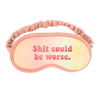 A cute pastel sleep mask that says shit could be worse 