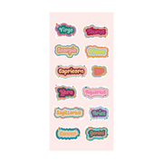 A pastel sticker sheet with all twelve zodiac signs in playful bubble letters. Each name—like Virgo, Taurus, Leo, and Pisces—is uniquely colored and outlined with layered shadows and sparkly accents. The background is soft pink, making the bright, colorful stickers pop.