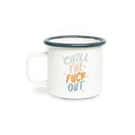 A ceramic white mug with the phrase "Chill the fuck out" on it in pastel coloring. Rim of mug is a navy blue.